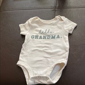 Cream Baby Onesie with Blue Text